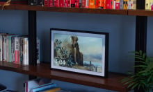 picture frame-esque smart screen on a bookshelf