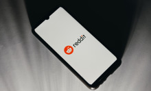 A smartphone displaying the Reddit logo