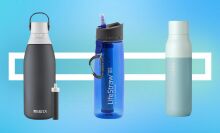 three filtered water bottles on blue background