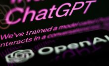 ChatGPT website displayed on a laptop screen and OpenAI logo displayed on a phone screen.