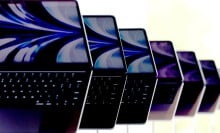 Brand new redesigned MacBook Air laptops are displayed during the WWDC22 at Apple Park on June 6, 2022 in Cupertino, California.