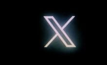 X logo in neon lights