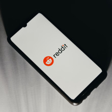 A smartphone displaying the Reddit logo