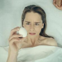 Emilia Clarke holds an egg in "Pod Generation."