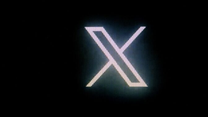 X logo in neon lights