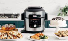 Ninja Foodi 14-in-1 Smart XL Multi-Cooker on counter surrounded by dishes