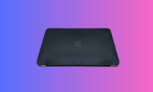 The refurbished, black MacBook Air overlaid on a colorful, gradient background.