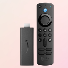 Amazon Fire TV stick on pastel pink background