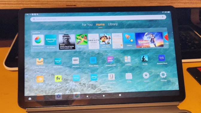 amazon fire max 11 tablet open to home screen with rows of app icons